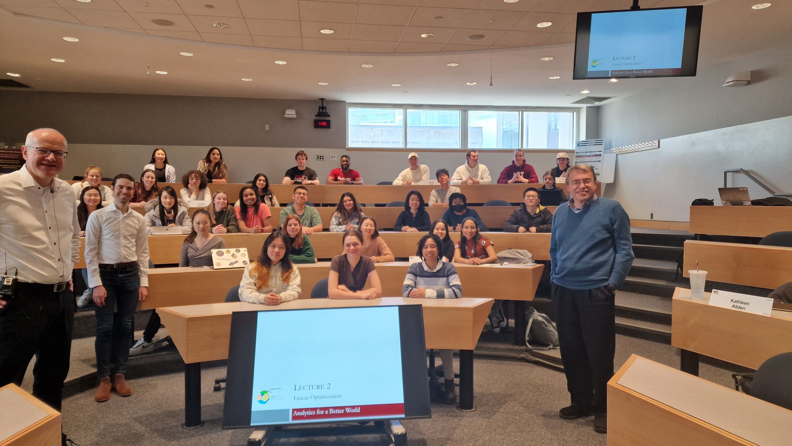 Prof. Dimitris Bertsimas and Prof. Dick den Hertog teaching the undergraduate course "Analytics for a Better World" at MIT